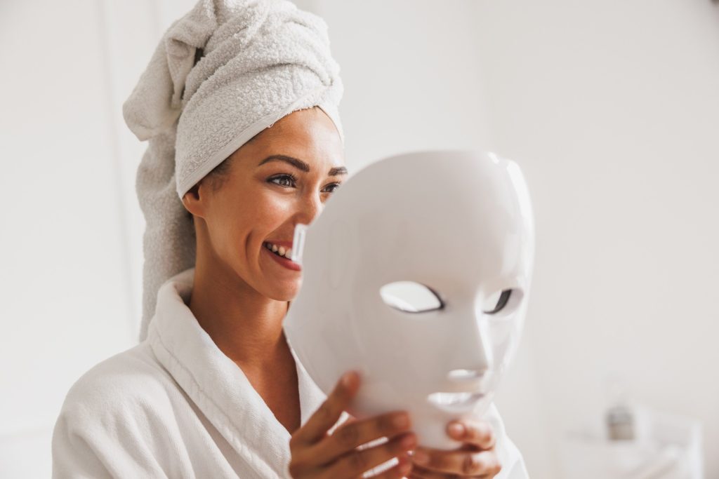 Woman Getting A Led Light Facial Mask Treatment At The Beauty Salon